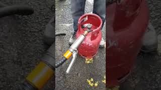 How to fill a propane gas bottle with an adaptor at a LPG filling station [upl. by Ahtiuqal]