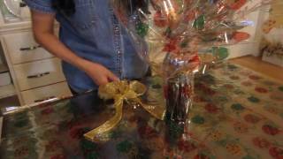 Wrapping a bottle in cellophane [upl. by Caril]